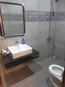 a bathroom with a sink and a toilet at Guest House Furnished Villa Bahria Town Karachi in Karachi
