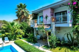 a view of a house with a swimming pool at Villa Garden Island in Dalyan