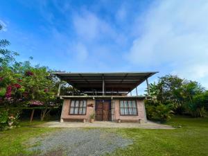 a small house with awning on top of it at Villa Daniela Restrepo in Restrepo