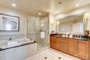 a bathroom with a tub and a shower and a sink at MGM Signature-31-816 Jacuzzi Studio in Las Vegas