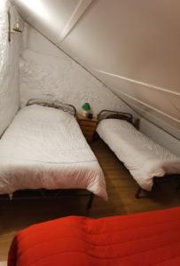 a room with two beds in a small room at Casa Rural Galaroza La Bella in Galaroza +20 photos