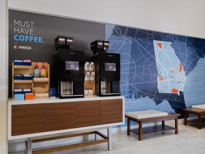 a coffee shop with a map on the wall at Holiday Inn Express & Suites Augusta West - Ft Gordon Area by IHG in Augusta