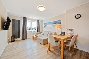 TV a/nebo společenská místnost v ubytování SNOWFLAKE Zentrale Lage Bikepark & Piste