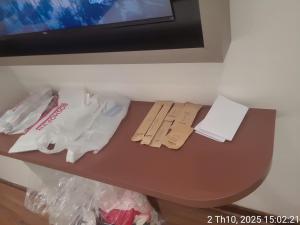 a brown table with some bags on top of it at Sulina Hlels 4 in Ho Chi Minh City