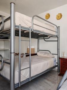Ένα ή περισσότερα κρεβάτια σε δωμάτιο στο La Casa del Café - Mesa de Juegos y Comfort