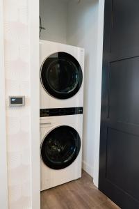 two washer and dryer stacked on top of each other at Husker Home TEN40 is in the heart of Downtown Lincoln where you can walk to Haymarket & UNL in Lincoln
