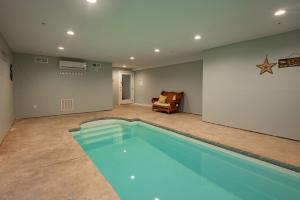 a large swimming pool in a living room at Blue Anchor in Swanton