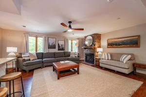 a living room with a couch and a fireplace at Blue Anchor in Swanton
