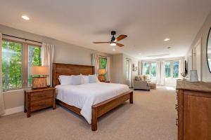 a bedroom with a bed and a ceiling fan at Blue Anchor in Swanton +43 photos