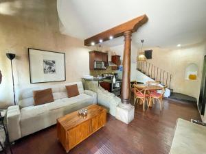 a living room with a couch and a table at Boutique Villa in Antigua in Antigua Guatemala