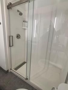 a shower with a glass door in a bathroom at Fairfield Inn & Suites Corpus Christi in Corpus Christi