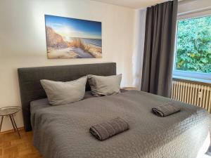 a bedroom with a bed with two pillows on it at 3 Zimmer Apartment mit Sauna in Pforzheim