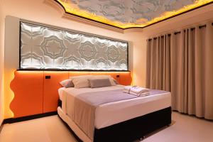 a bedroom with a bed and a large window at Casa Stella Rooms in Cartagena de Indias +93 photos
