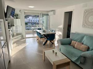 a living room with a couch and a table at Delmar Apartment in Alicante
