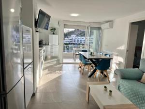 a living room with a couch and a table at Delmar Apartment in Alicante
