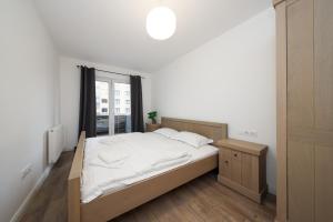 Postel nebo postele na pokoji v ubytování Anima Apartments - Coresi