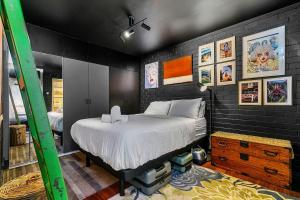 a bedroom with a large bed in a room at Black Canvas Lux Getaway in Cottesloe
