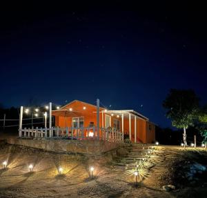 a house at night with lights in front of it at Rancho 29 VDG in Ensenada +4 photos