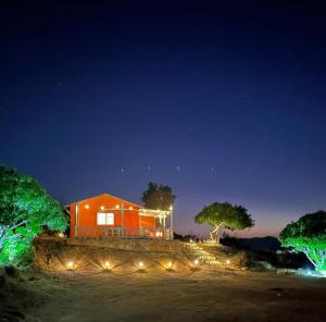 a house is lit up at night with lights at Rancho 29 VDG in Ensenada