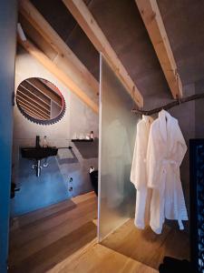 a bathroom with a sink and a mirror at Casa da Eira, Casaspensadas in Juncal