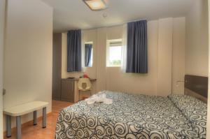 Postel nebo postele na pokoji v ubytování Hotel Pasha