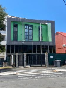 a building that is green and gray at LOFT DIONYSIEN DE STANDING in Saint-Denis