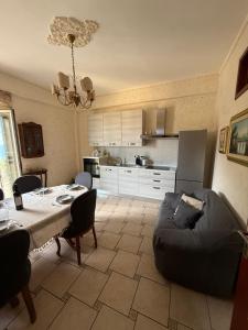 a living room with a table and a couch at Casa da Rosaria in Taormina