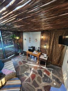 a living room with a couch and a table at Maple Tree Manor in Durban