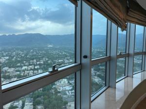 a view from the top of a building with windows at Mountain View Luxury Centaurus Mall Apartment Islamabad in Islamabad