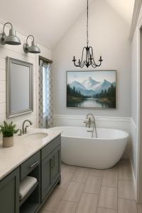 a bathroom with a bath tub and a chandelier at Vail Alpine Stay in Vail