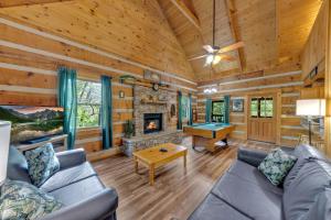 a living room with a couch and a pool table at Whispers of the Smokies Hot Tub Pool Table Grill in Glade