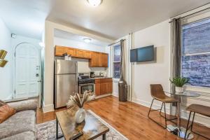 a living room with a couch and a table at Charming 1BR in Center City that Sleeps 4 with Fast WiFi in Philadelphia +8 photos