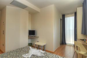 TV a/nebo společenská místnost v ubytování Hotel Pasha
