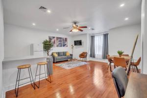 a living room with a couch and a table at Huge and Sunny 1BR in Center City in Philadelphia