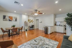 a living room with a table and a kitchen at Huge and Sunny 1BR in Center City in Philadelphia
