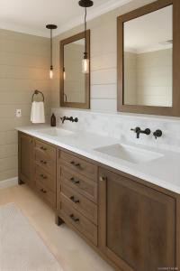 a bathroom with two sinks and a mirror at Vail Alpine Stay in Vail +4 photos