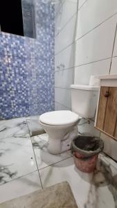 a dirty bathroom with a toilet in a room at Ayur nidhi Eco Hostel in Petrópolis