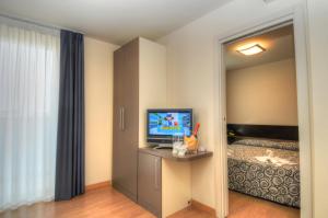 TV a/nebo společenská místnost v ubytování Hotel Pasha