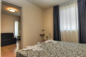 Postel nebo postele na pokoji v ubytování Hotel Pasha
