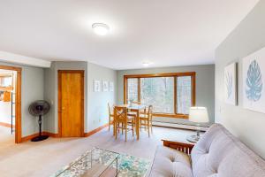 a living room with a couch and a table at Edson Hill Getaway #4 in Stowe Fork +11 photos