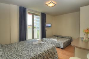 Postel nebo postele na pokoji v ubytování Hotel Pasha