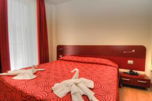 Postel nebo postele na pokoji v ubytování Hotel Pasha