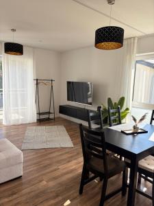 Televisyen dan/atau pusat hiburan di Schöne Wohnung in ruhiger Lage