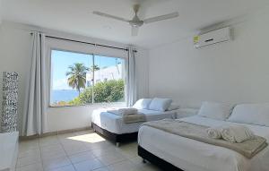 Ένα ή περισσότερα κρεβάτια σε δωμάτιο στο Cabaña ideal con piscina propia y salida al mar +14 φωτογραφίες