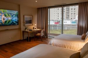 Ένα ή περισσότερα κρεβάτια σε δωμάτιο στο S22 Hotel & Suites +39 φωτογραφίες