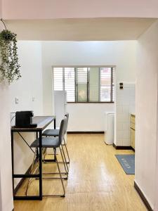 an empty room with a table and a chair at Bat Galim BEACH- Mirror apartment in Haifa