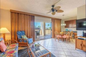 a living room with a couch and a table at Kona Plaza#409 in Kailua-Kona