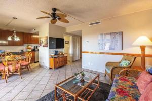 a living room with a couch and a table at Kona Plaza#409 in Kailua-Kona