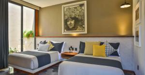 Postel nebo postele na pokoji v ubytování Hotel Criol
