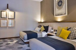 Postel nebo postele na pokoji v ubytování Hotel Criol